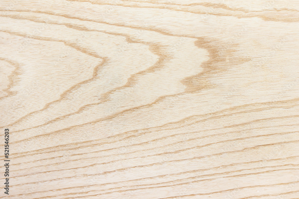Close-up of raw ash wood showing natural grain and texture