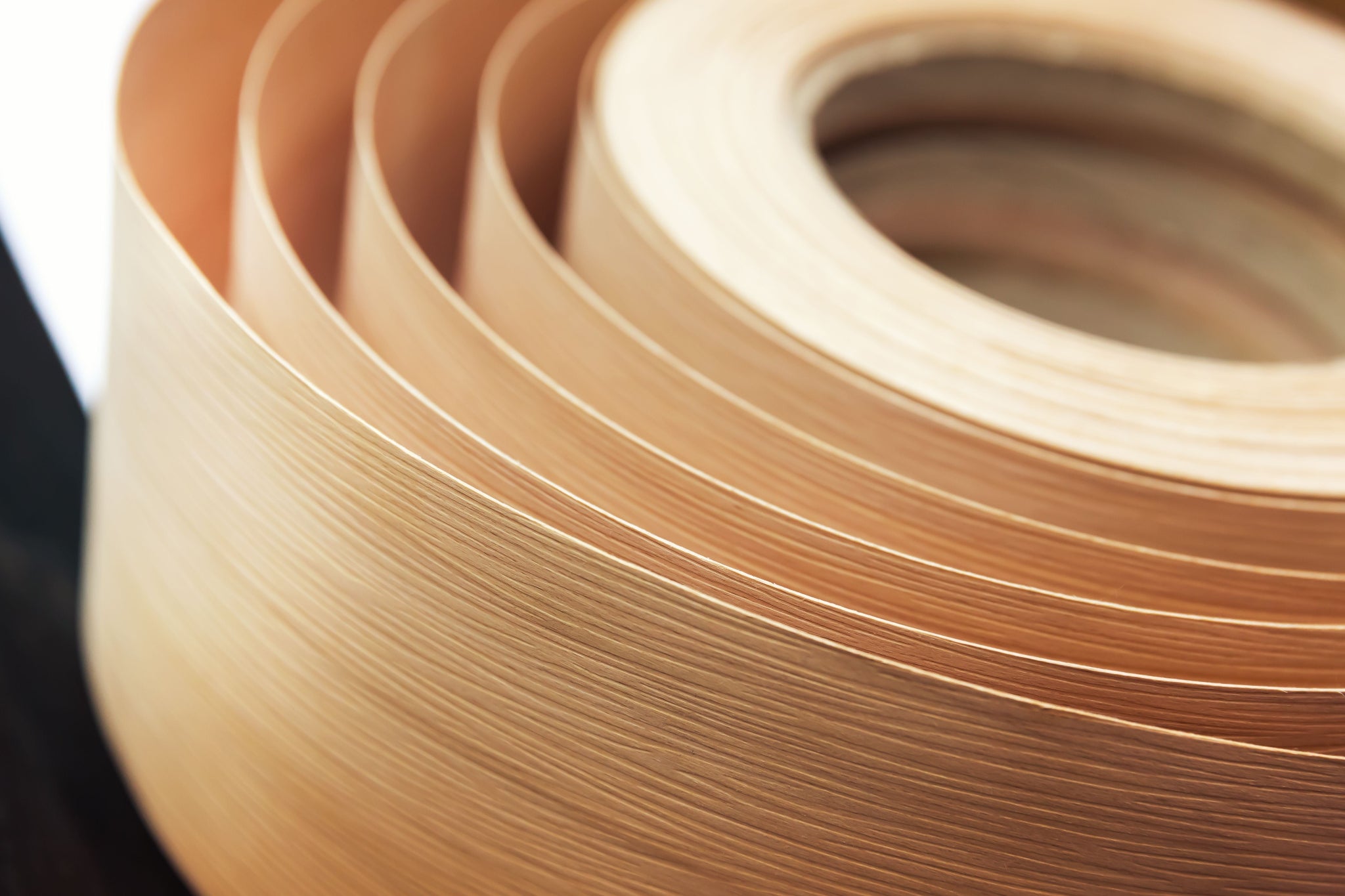 Close-up of a roll of Veneer with a blurred background
