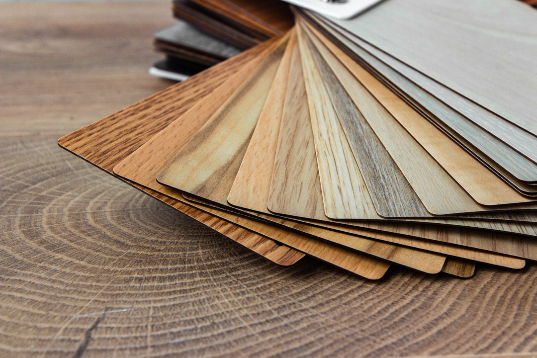 Wooden sample swatches arranged on a wooden surface