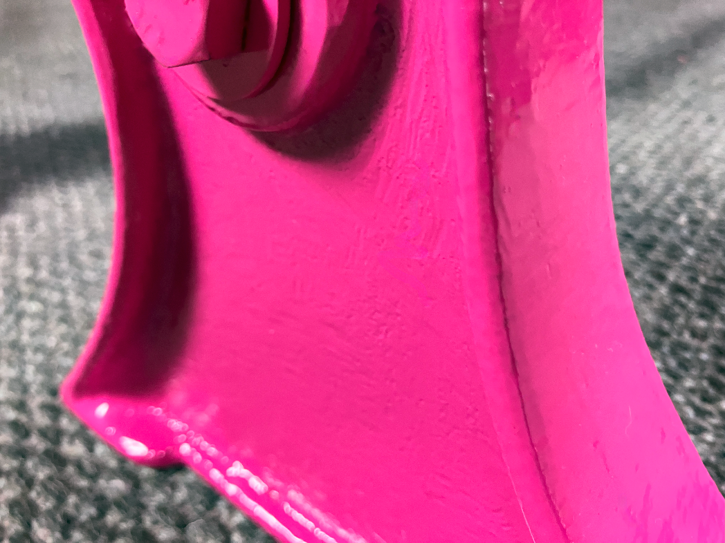 Detailed view of vibrant hot pink cast iron foot from Colpop collection