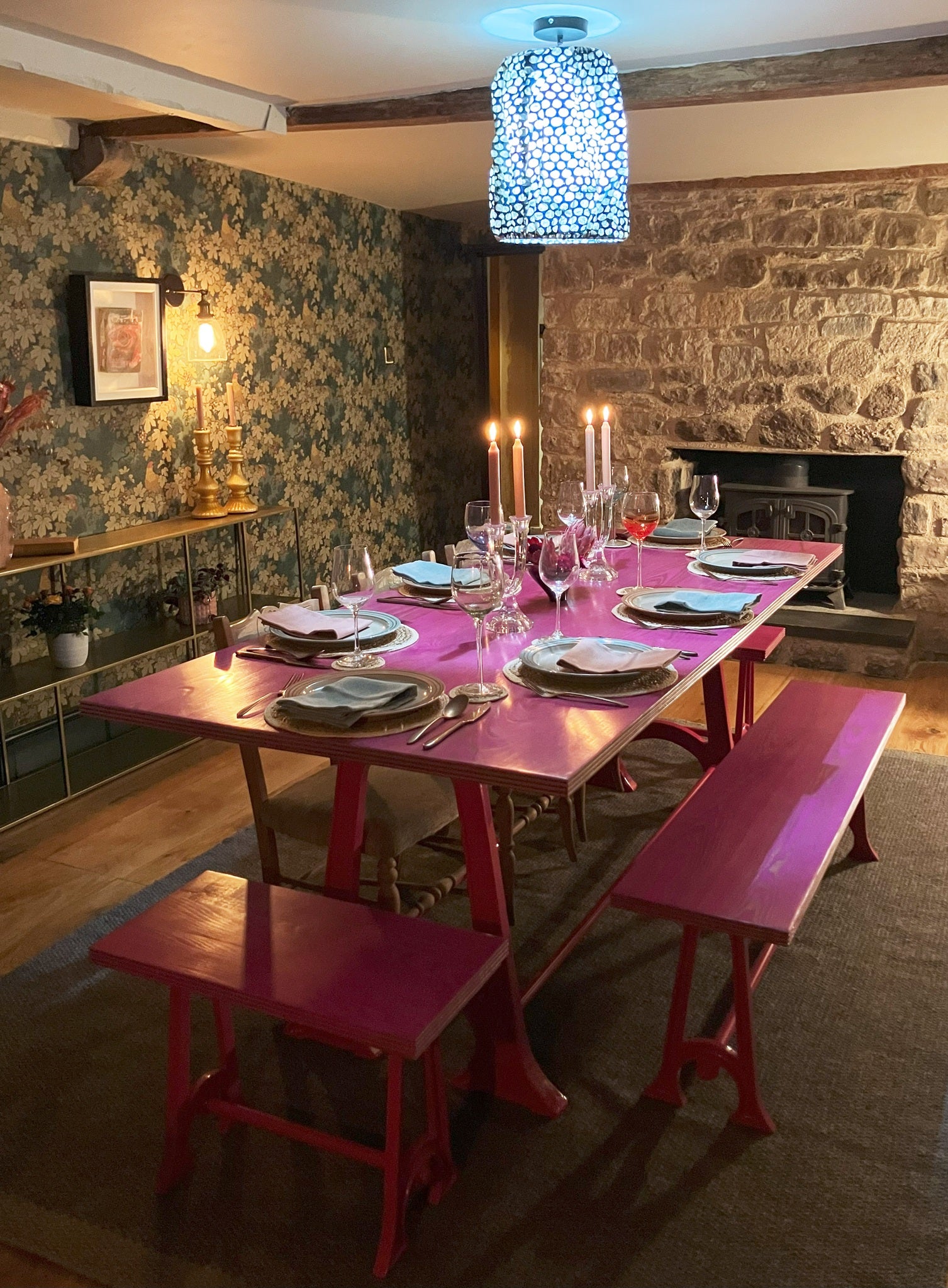 Pink colpop table set for 8 for Dinner in cottage setting. 