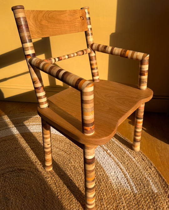 Palaya Carver Chair in sunlight - with arms